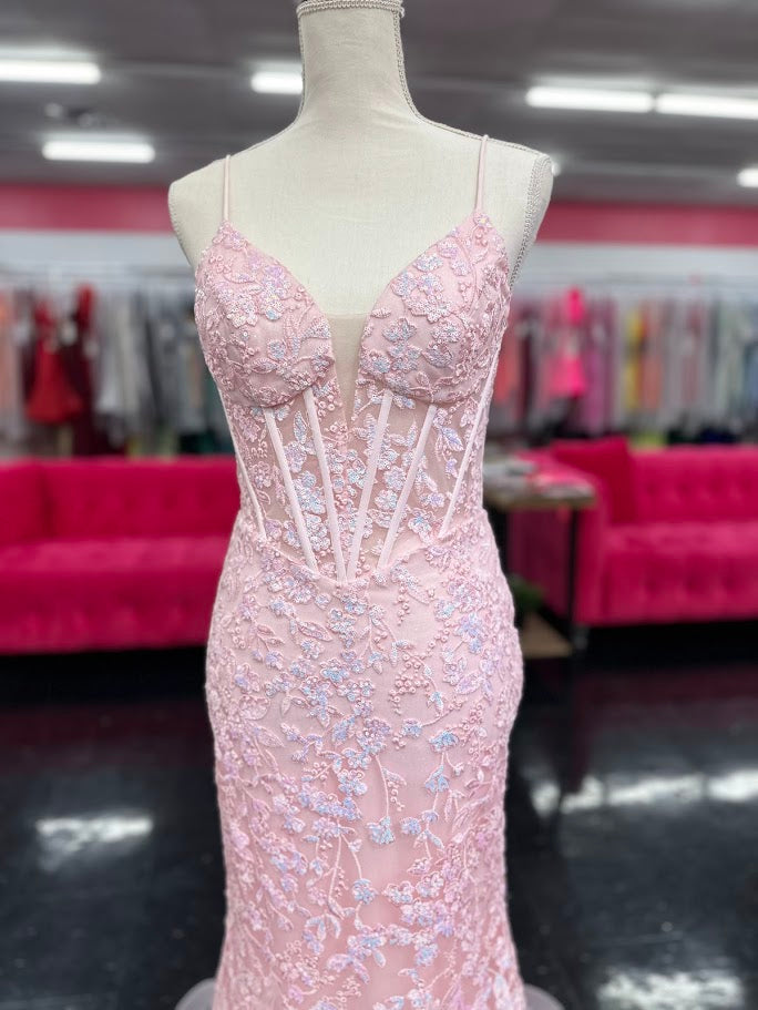 Elevate your formal occasion with the Nina Canacci 4434 gown, designed in a delicate peach hue. This size 4 mermaid dress features a sheer lace corset bodice adorned with subtle sequins, creating an elegant shimmer. The flattering V-neckline enhances your silhouette, while the fitted mermaid skirt offers a graceful, sophisticated finish perfect for prom or any special event.

Size: 4

Color: Peach