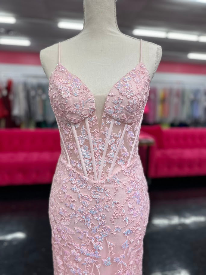 Elevate your formal occasion with the Nina Canacci 4434 gown, designed in a delicate peach hue. This size 4 mermaid dress features a sheer lace corset bodice adorned with subtle sequins, creating an elegant shimmer. The flattering V-neckline enhances your silhouette, while the fitted mermaid skirt offers a graceful, sophisticated finish perfect for prom or any special event.

Size: 4

Color: Peach