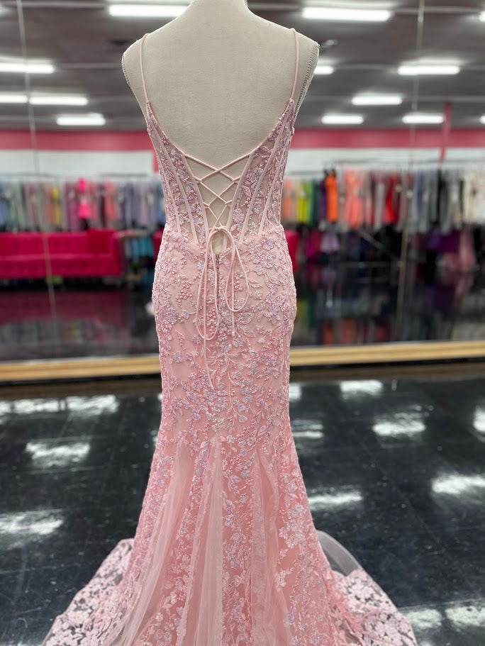 Elevate your formal occasion with the Nina Canacci 4434 gown, designed in a delicate peach hue. This size 4 mermaid dress features a sheer lace corset bodice adorned with subtle sequins, creating an elegant shimmer. The flattering V-neckline enhances your silhouette, while the fitted mermaid skirt offers a graceful, sophisticated finish perfect for prom or any special event.

Size: 4

Color: Peach