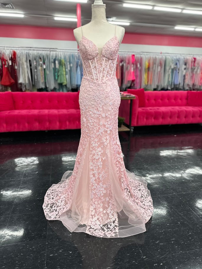 Elevate your formal occasion with the Nina Canacci 4434 gown, designed in a delicate peach hue. This size 4 mermaid dress features a sheer lace corset bodice adorned with subtle sequins, creating an elegant shimmer. The flattering V-neckline enhances your silhouette, while the fitted mermaid skirt offers a graceful, sophisticated finish perfect for prom or any special event.

Size: 4

Color: Peach