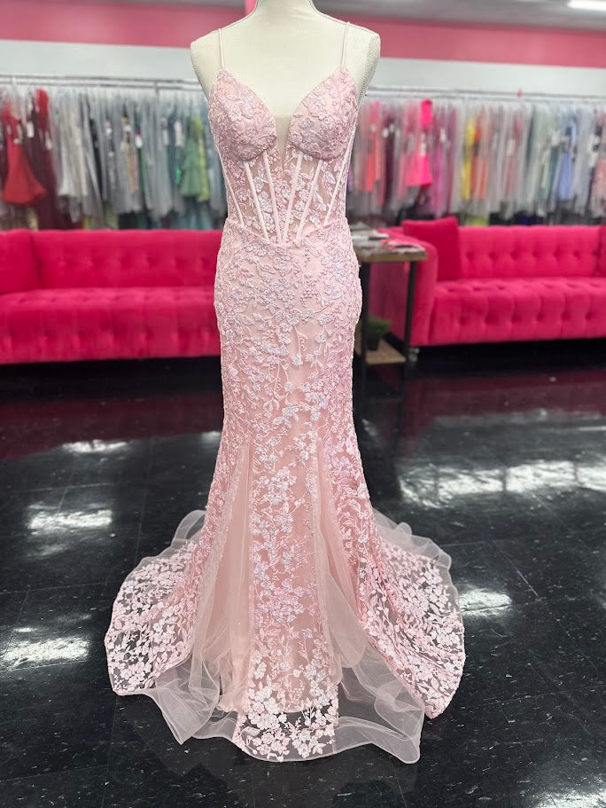 Elevate your formal occasion with the Nina Canacci 4434 gown, designed in a delicate peach hue. This size 4 mermaid dress features a sheer lace corset bodice adorned with subtle sequins, creating an elegant shimmer. The flattering V-neckline enhances your silhouette, while the fitted mermaid skirt offers a graceful, sophisticated finish perfect for prom or any special event.

Size: 4

Color: Peach