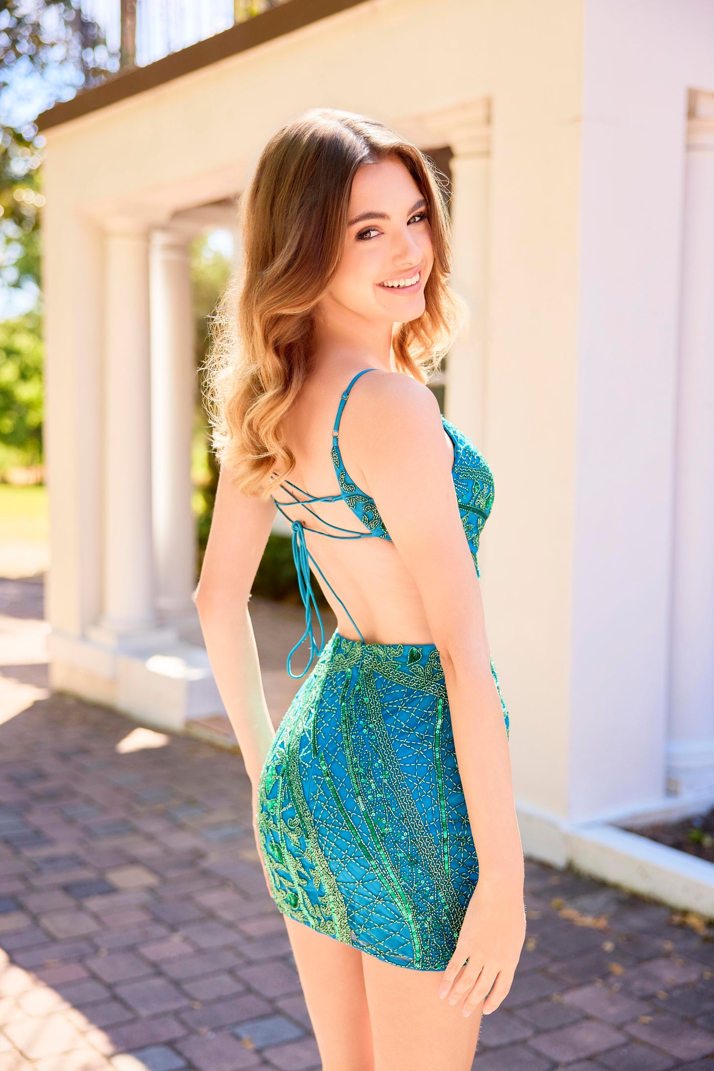 The Primavera Couture 4435 is a sophisticated short cocktail gown featuring delicate beadwork and stylish cutouts. Its V-neckline and backless corset design create an elegant and flattering silhouette, perfect for making a memorable impression at homecoming or any special event.

Sizes: 000-16

Colors: Black/Gold, Black/Blue, Peacock/Emerald