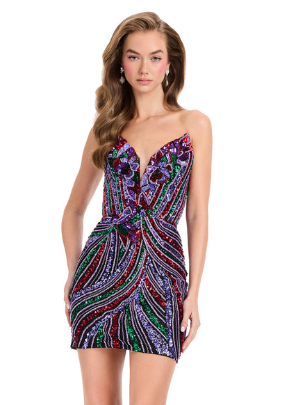 A woman modeling a strapless mini dress covered in colorful sequins with a swirling paisley-like pattern on a plain white background.