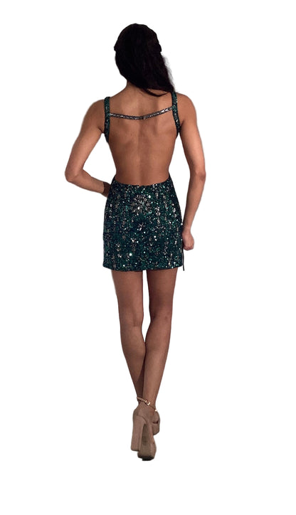 Elevate your event style with the Jovani 46087, a short cocktail dress designed for a stunning silhouette. Featuring intricate sequin and bead detailing, this gown captures light beautifully for undeniable allure. The open-back design adds a modern, bold touch, making it perfect for homecoming or any special occasion where you want to stand out with elegance and sophistication. Comfortable yet striking, it balances glamour with a confident, contemporary edge.

Sizes: 00-24

Colors: Black/Silver, Gold/Silver