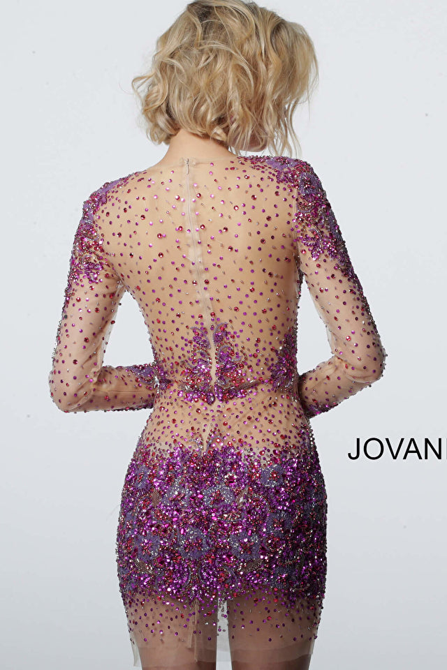 Jovani's 47598 Sheer Beaded Dress is perfect for any special event. Featuring a sheer beaded design, long sleeves, and a short fit, this dress exudes elegance and sophistication. Expertly crafted from high-quality materials, this design will ensure you look and feel your best.