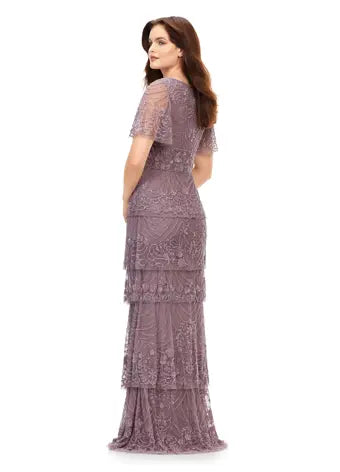 Ashley Lauren 11235 Multi Tiered Sequin V-Neck Butterfly Sleeve Fully Beaded Gown. This elegant sequin gown features a v-neckline with butterfly flutter sleeves. The wide waist band is sure to cinch the waist and provide the perfect silhouette. The bustier and multi tiered skirt are accented with the same intricate floral bead pattern throughout.