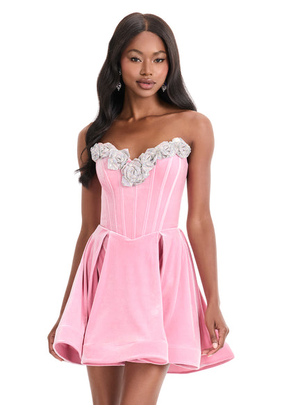 This Ashley Lauren 4871 cocktail dress features a flattering fit-and-flare silhouette crafted from luxurious velvet for a smooth, elegant finish. The short length balances sophistication with playful charm, while delicate crystal flower embellishments add a refined sparkle, making it an ideal choice for homecoming or special occasions. Designed to enhance your figure, this gown offers both comfort and style for memorable evening events. Make a statement in the ASHLEYlauren Style 4871 mini dress crafted from