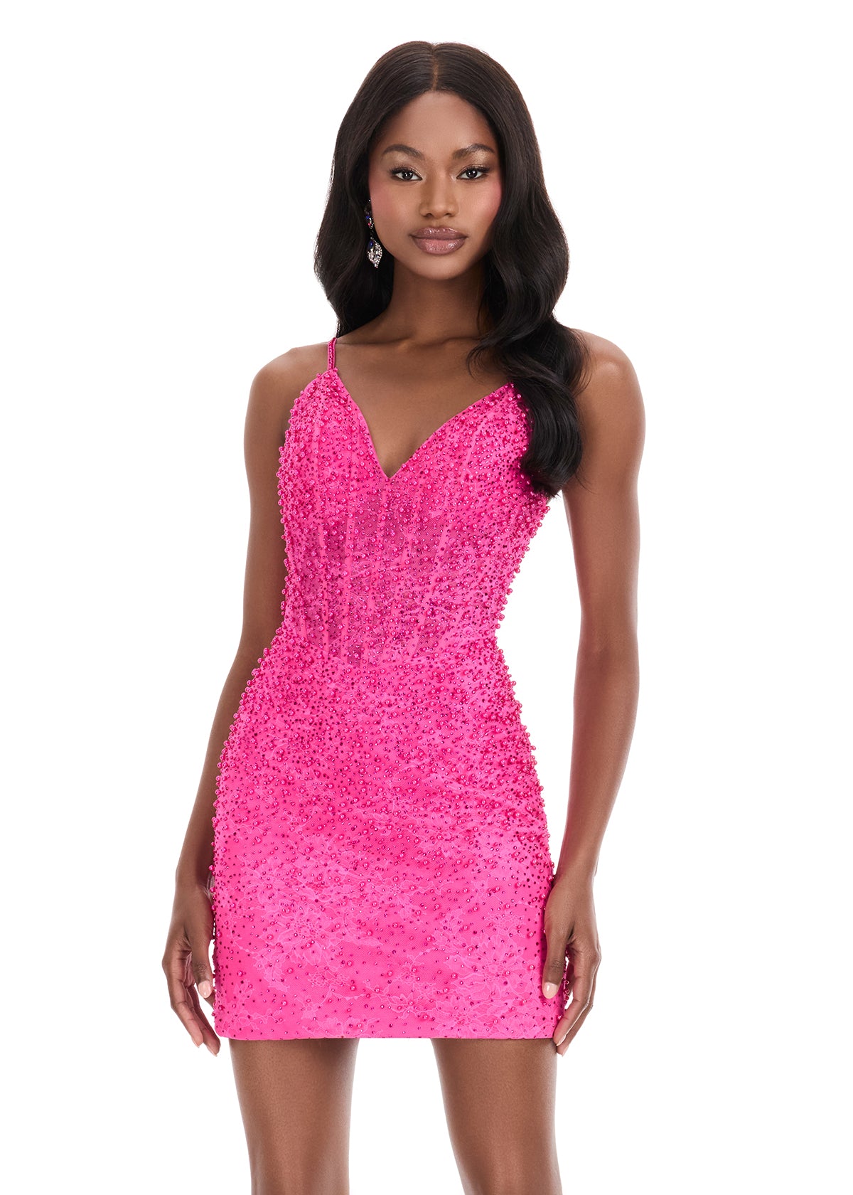 The Ashley Lauren 4925 Lace Cocktail Dress combines sophisticated design with intricate detailing, featuring a sheer corset bodice accented by delicate beadwork. Its fitted silhouette flatters the figure, making it an ideal choice for homecoming or special evening events. Crafted for both elegance and comfort, this gown seamlessly blends classic lace with modern structure for a timeless look. This stunning ASHLEYlauren 4925 mini dress features a delicate lace overlay adorned with press-on embellishments tha