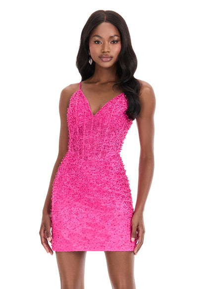 The Ashley Lauren 4925 Lace Cocktail Dress combines sophisticated design with intricate detailing, featuring a sheer corset bodice accented by delicate beadwork. Its fitted silhouette flatters the figure, making it an ideal choice for homecoming or special evening events. Crafted for both elegance and comfort, this gown seamlessly blends classic lace with modern structure for a timeless look. This stunning ASHLEYlauren 4925 mini dress features a delicate lace overlay adorned with press-on embellishments tha