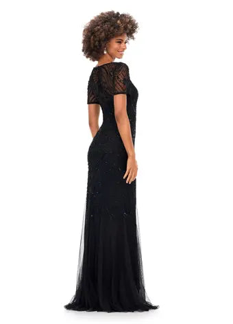 Ashley Lauren 11215 Illusion Sweetheart Neckline Beaded Mermaid Silhouette Short Sleeve Evening. Dazzle in this illusion sweatheart neckline gown. The inticate sequin motifs flows throughout the neckline, sleeves and down the gown. The skirt is finished with godets to create the perfect silhouette.