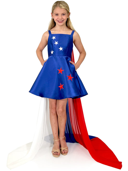 Marc Defang 5030 Red White & Blue Girls Pageant Fun Fashion Cape Detachable chiffon skirt/cape. Stars adorn he short a line dress. Perfect for Fun Fashion! Fourth of July - Independence Day Pageant  Available Sizes: 4-14  Colors: Red/White/Blue