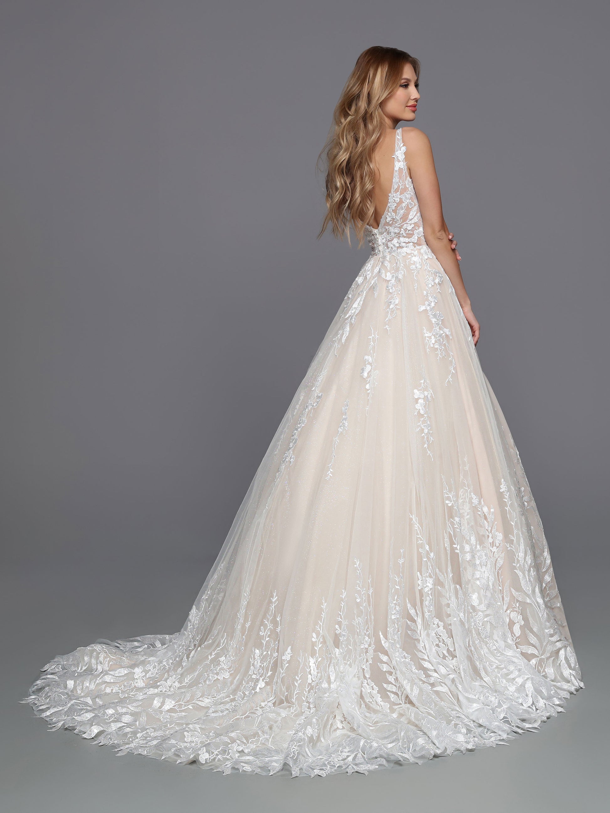 DaVinci Bridal 50751 A-Line Ballgown Sweetheart Neckline Tulle Lace Appliques Sheer Open Back Wedding Gown. The modern lines of this tulle and lace ball gown are softened by blossom and vine lace that wraps the bodice and trails down the skirt to create a textured hem for the chapel train.