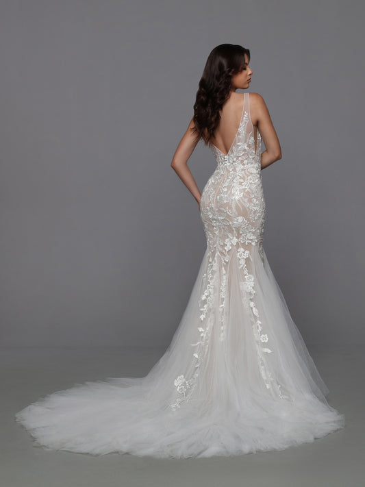 DaVinci Bridal 50765 Mermaid V-Neck Lace Applique Open Back Train Wedding Gown. Designer details of this classic silhouette include the option of a nude-look bodice with latte lining and gorgeous lace applique tracing the lines of the fluffy mermaid skirt.