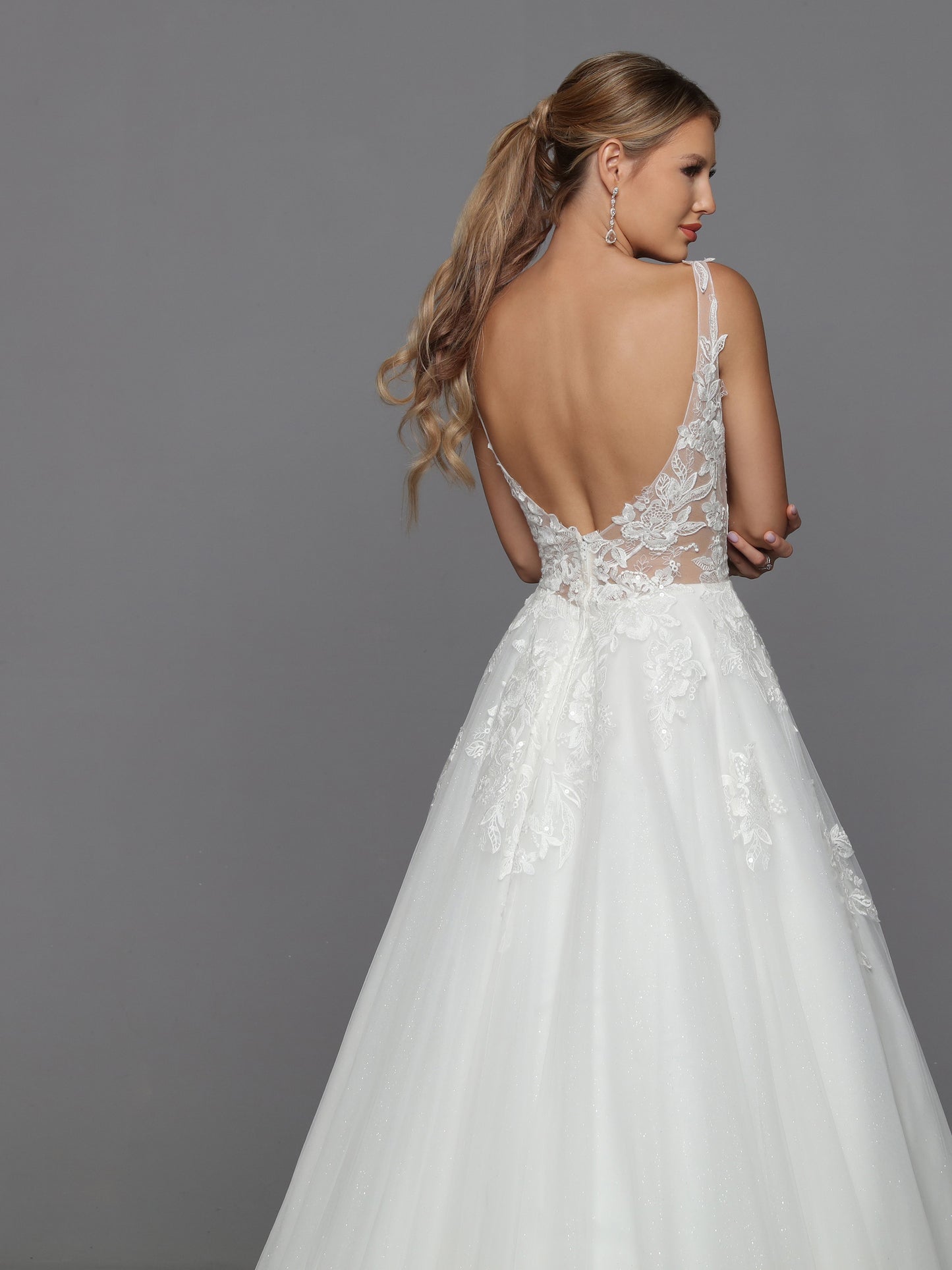 DaVinci Bridal 50769 A-Line Ballgown Illusion High Neck Long Sleeve Floral Lace Train Wedding Gown. Convertible dresses are always on-trend, like this lush ball gown with sheer full-length sleeves highlighted with rich lace applique. The alluring low scoop back is balanced by the modest bateau neckline.