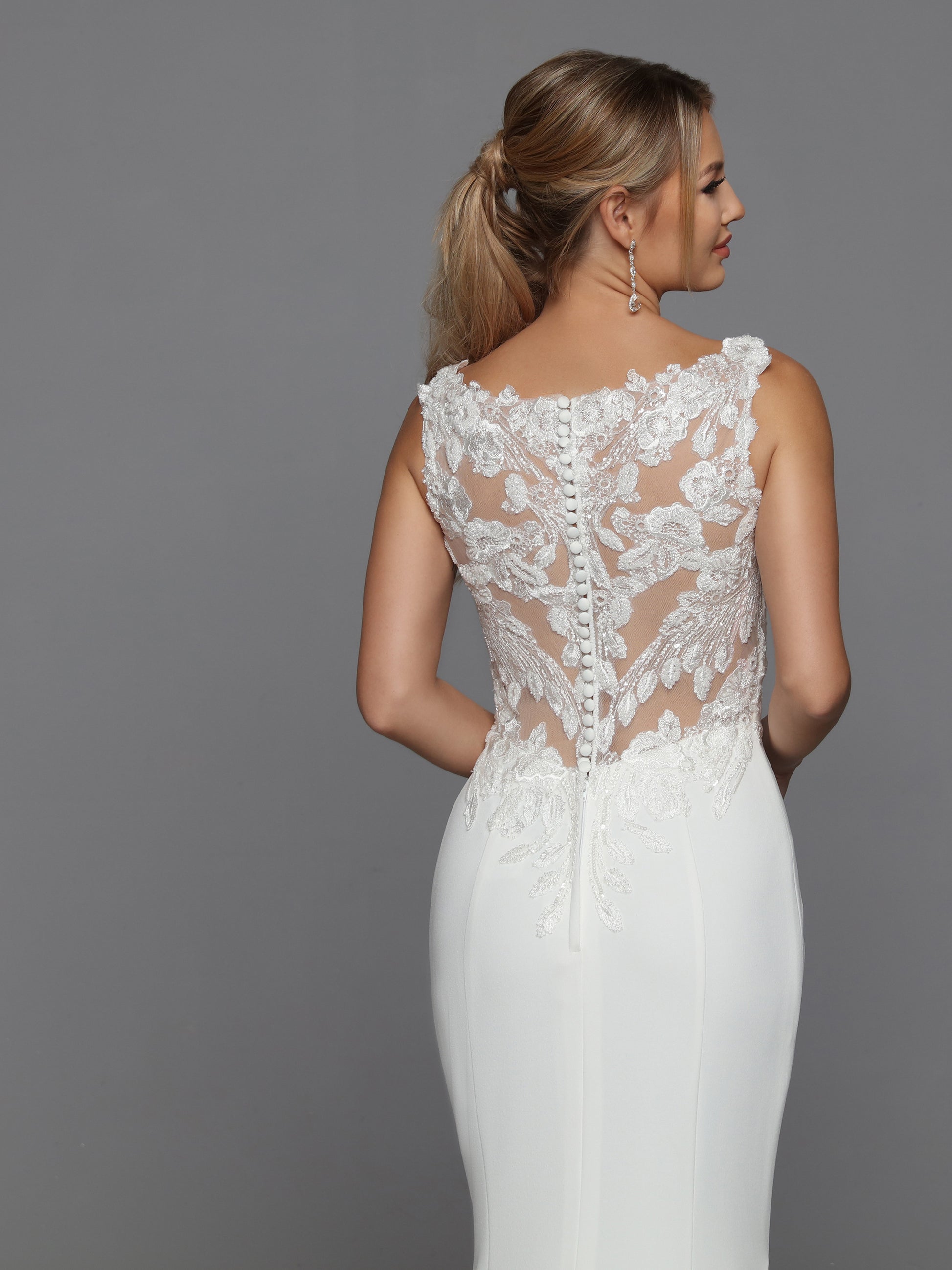 DaVinci Bridal 50776 Fit And Flare V-Neck Sheer Lace Applique Back Bodice Sleeves Train Wedding Gown. Sleek and sophisticated, this crepe fit and flare gown features removable full-length lace sleeves, a sheer lace applique back bodice, and a column of lustrous crepe finished with a chapel train.