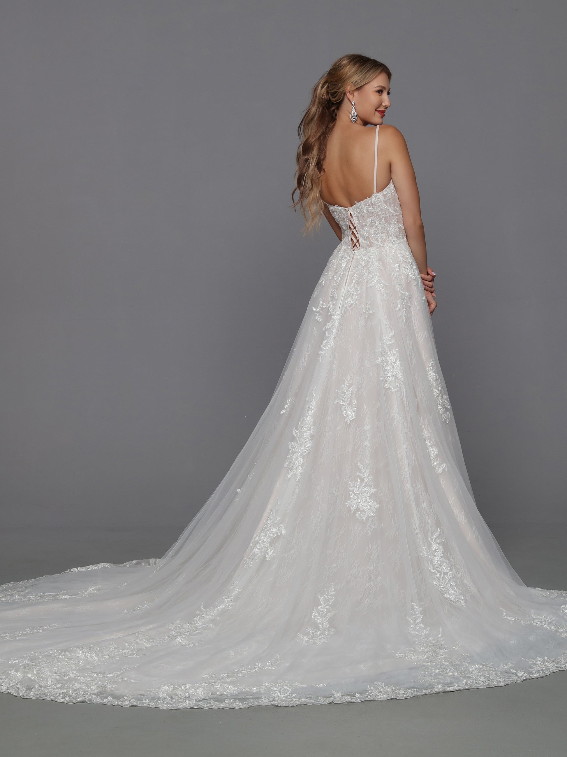 DaVinci Bridal 50786 A-Line Ballgown Plunging Neckline Spaghetti Straps Floral Lace Appliques Train Lace Up Back Wedding Gown. This pretty lace slip dress can be anything you want it to be. Wear it as shown for a soft A-line look or add a fluffy petticoat for a Cinderella ball gown vibe.