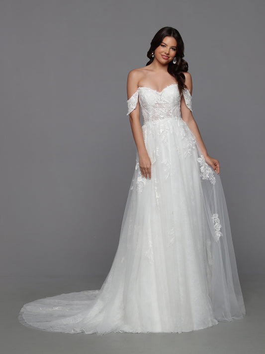 Look effortlessly feminine on your big day with Davinci Bridal 50787 Long Lace A Line wedding dress. Crafted with an off-the-shoulder bodice and sheer skirt adorned with delicate lace applique, the fitted bodice features a beaded front and back that adds a touch of glamour. Perfect for a romantic, yet modern look!  Sizes: 2-20  Colors: Ivory