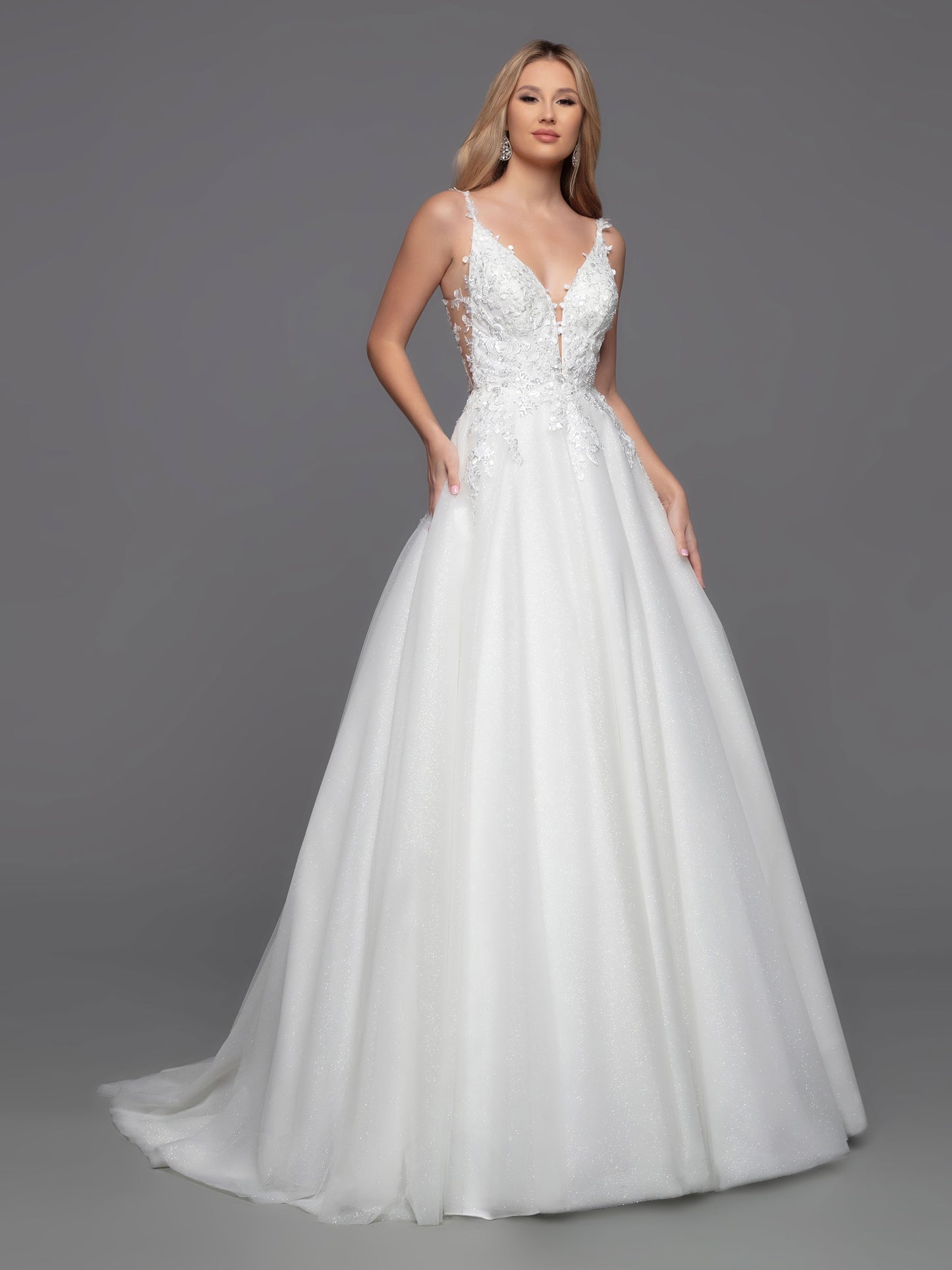 Davinci Bridal 50801 Long Shimmer Tulle Ballgown Sheer lace wedding dress Open Back is a timeless choice with a modern twist. This ball gown features a classic layered tulle skirt and a contemporary bodice with sheer sides, a low keyhole and covered button detail. The perfect combination of style and sophistication for any special occasion.  Sizes: 2-20  Colors: Ivory