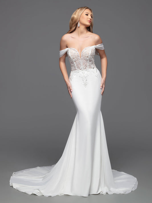 This Davinci Bridal 50803 Sheer Beaded Bodice wedding dress is a timeless choice for your special day. An elegant fit & flare silhouette with a corseted back, beaded appliques, and soft off-the-shoulder straps that flatter the neck and shoulders. The simple crepe skirt completes the classic look.  Sizes: 2-20  Colors: Ivory 