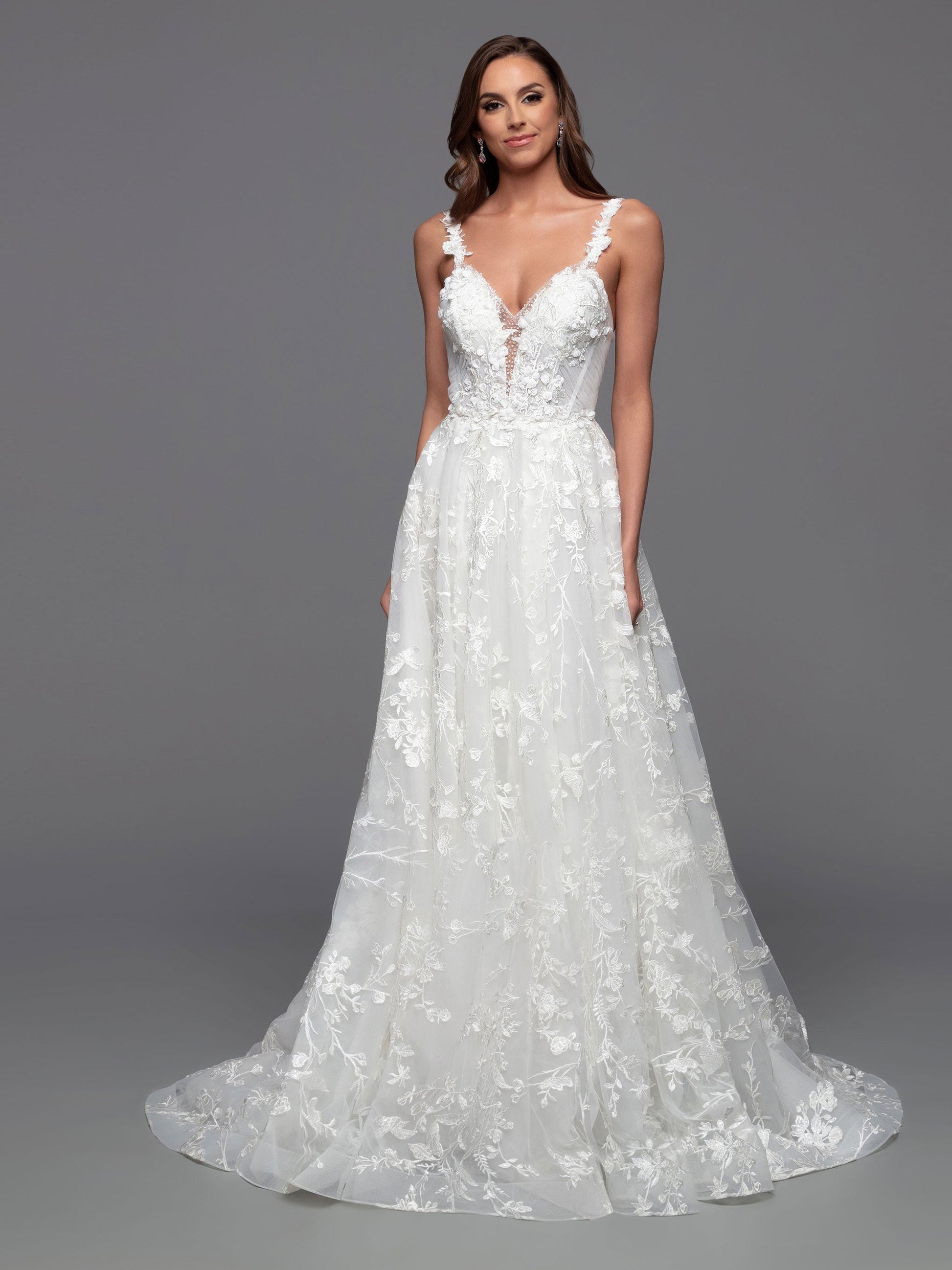 Look stunning on your special day in this Davinci Bridal 50806 A Line Lace Cape Wedding Dress. Constructed with a sheer crystal plunging neckline and 3D floral embroidery on the front and back bodice, this gown provides an exquisite look with gathered skirt and chapel train. Plus, you can customize your look and stand out in photos with the addition of the detachable veil wings.  Sizes: 2-20  Colors: Ivory