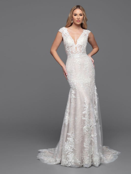 The classic wedding dress of your dreams. This Davinci Bridal 50807 dress is crafted from tulle and lace and features a sheer bodice, low V-back, and cap sleeves embellished with bold floral lace appliques. Its fit & flare silhouette is finished with a chapel train for a timeless look. 