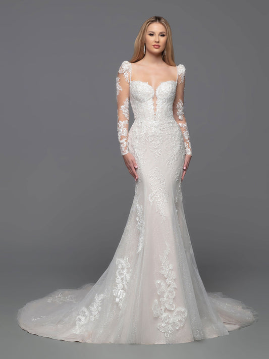 Look beautiful in this classic Davinci Bridal 50809 wedding dress. The tulle and lace fit & flare corset gown features a lace bodice, beaded shoulder straps, and corset back. Detachable full-length sheer lace applique sleeves give you the option to stay warm with full-coverage during the ceremony.  Sizes: 2-20  Colors: Ivory/Blush, Ivory/Ivory