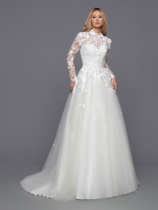 Look stunning on your big day with Davinci Bridal 50813. This beautiful tulle ballgown features a long a-line silhouette with a detachable lace long sleeve high neck jacket. Perfect for modest brides and cold weather weddings, the sheer lace bodice, back, and full-length sleeves create a breathtaking look. Lace accent at the waist of the layered skirt, and a chapel train, completes this stunning ensemble.  Sizes: 2-20  Colors: Ivory