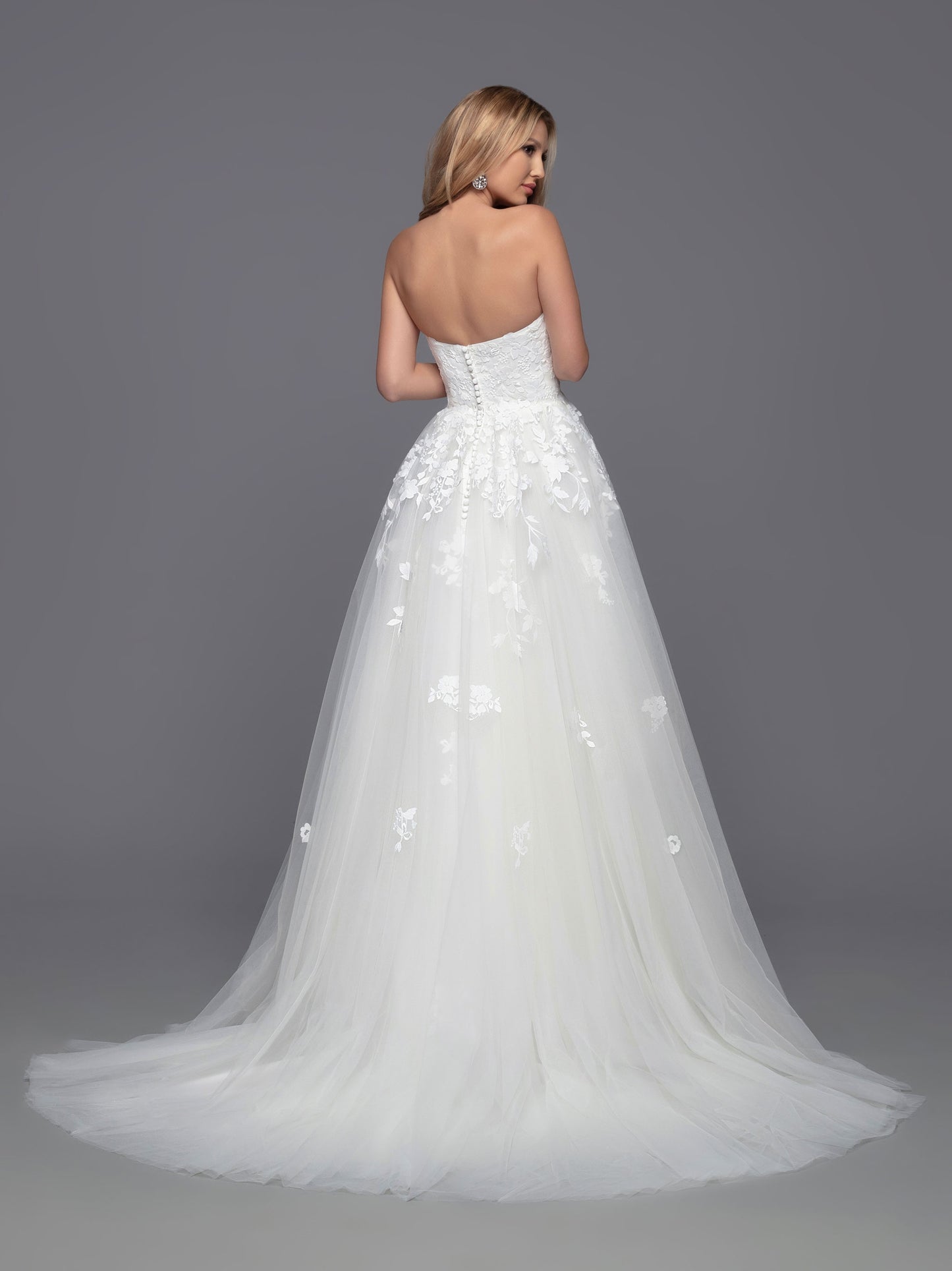 Look stunning on your big day with Davinci Bridal 50813. This beautiful tulle ballgown features a long a-line silhouette with a detachable lace long sleeve high neck jacket. Perfect for modest brides and cold weather weddings, the sheer lace bodice, back, and full-length sleeves create a breathtaking look. Lace accent at the waist of the layered skirt, and a chapel train, completes this stunning ensemble.  Sizes: 2-20  Colors: Ivory