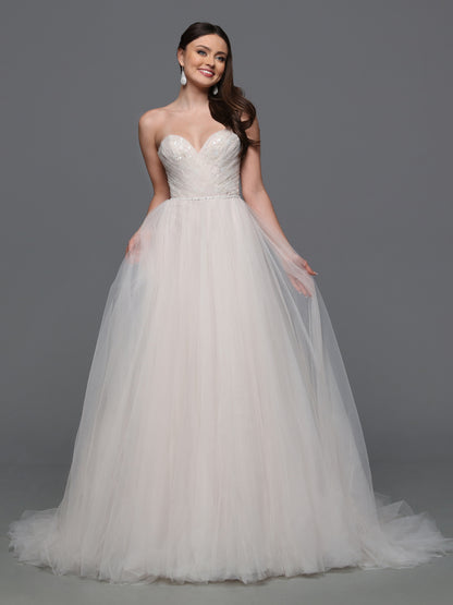 This elegant Davinci Bridal gown features a flattering A-line silhouette crafted from delicate ivory tulle. Intricate beadwork enhances the bodice, gracefully complementing the sweetheart neckline. Designed for timeless sophistication, this size 12 dress offers a perfect blend of classic charm and modern refinement for your special day. A traditional bridal silhouette with a soft finish, this gorgeous ball gown wedding dress has a ruched bodice over sparkling beaded lace and a full tulle skirt with a feathe