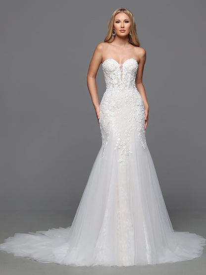 This exquisite Davinci Bridal gown features an ivory beaded lace corset that elegantly sculpts the silhouette. Designed in a flattering mermaid style, it gracefully hugs the body before flaring out, creating a timeless and sophisticated look. The off-the-shoulder neckline adds a romantic touch, perfect for a bride seeking classic elegance on her special day. Traditional with on-trend touches, this wedding dress features a sheer lace bodice and a mermaid-style skirt. The detachable off-the-shoulder straps so