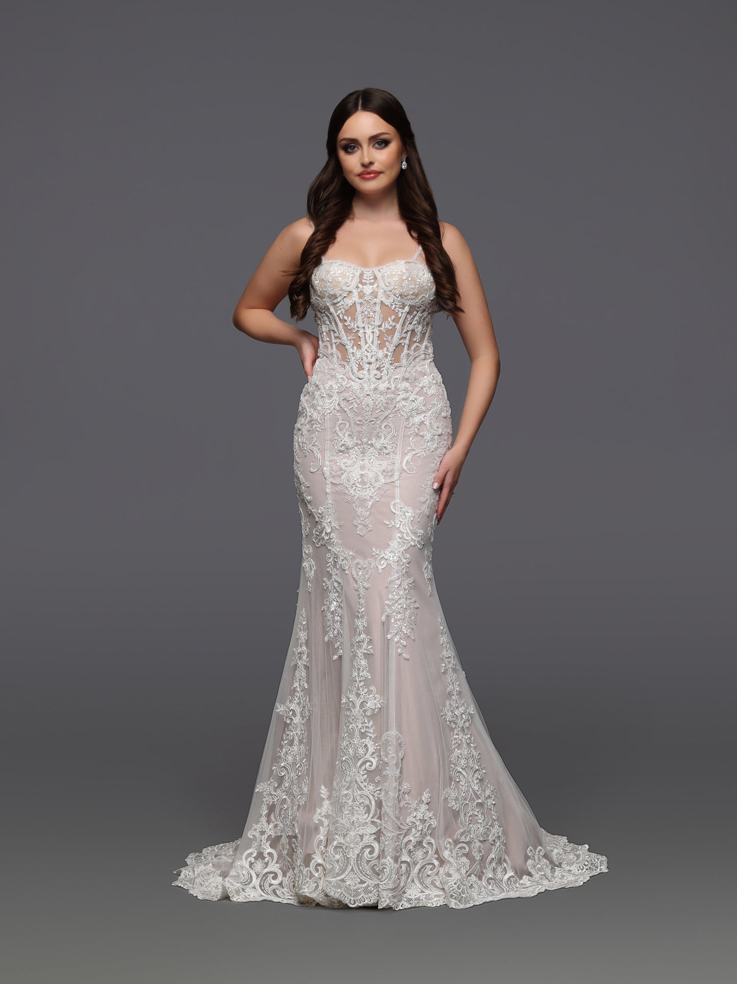 Elevate your bridal elegance with the Davinci Bridal 50929 gown. This size 6 ivory dress features a sheer corset bodice adorned with delicate beadwork, creating a refined and graceful silhouette. The fit and flare design enhances your natural curves while offering timeless sophistication for your special day. Perfect for brides seeking a blend of classic charm and modern allure.&nbsp;

Fabric:&nbsp;Lace, Tulle

Neckline:&nbsp;Modest, Straight Across, Straps

Silhouette:&nbsp;Fit &amp; Flare

Details:&nbsp;B