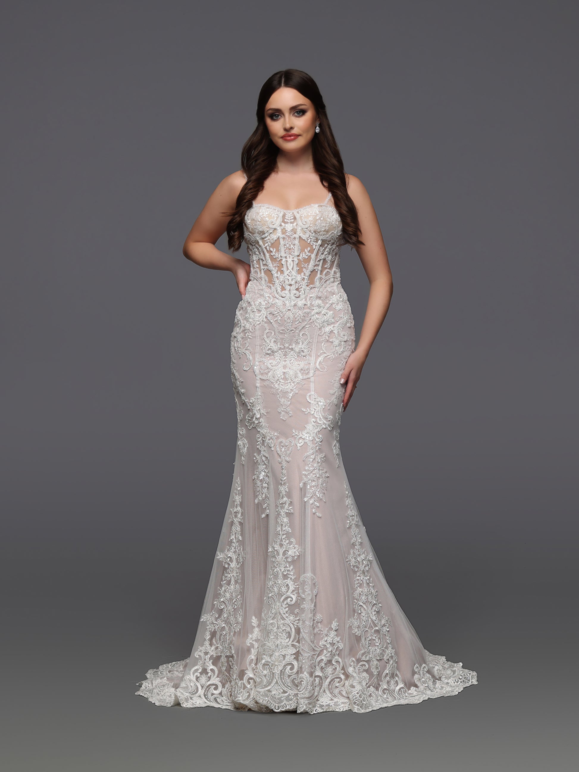 Elevate your bridal elegance with the Davinci Bridal 50929 gown. This size 6 ivory dress features a sheer corset bodice adorned with delicate beadwork, creating a refined and graceful silhouette. The fit and flare design enhances your natural curves while offering timeless sophistication for your special day. Perfect for brides seeking a blend of classic charm and modern allure.&nbsp;

Fabric:&nbsp;Lace, Tulle

Neckline:&nbsp;Modest, Straight Across, Straps

Silhouette:&nbsp;Fit &amp; Flare

Details:&nbsp;B
