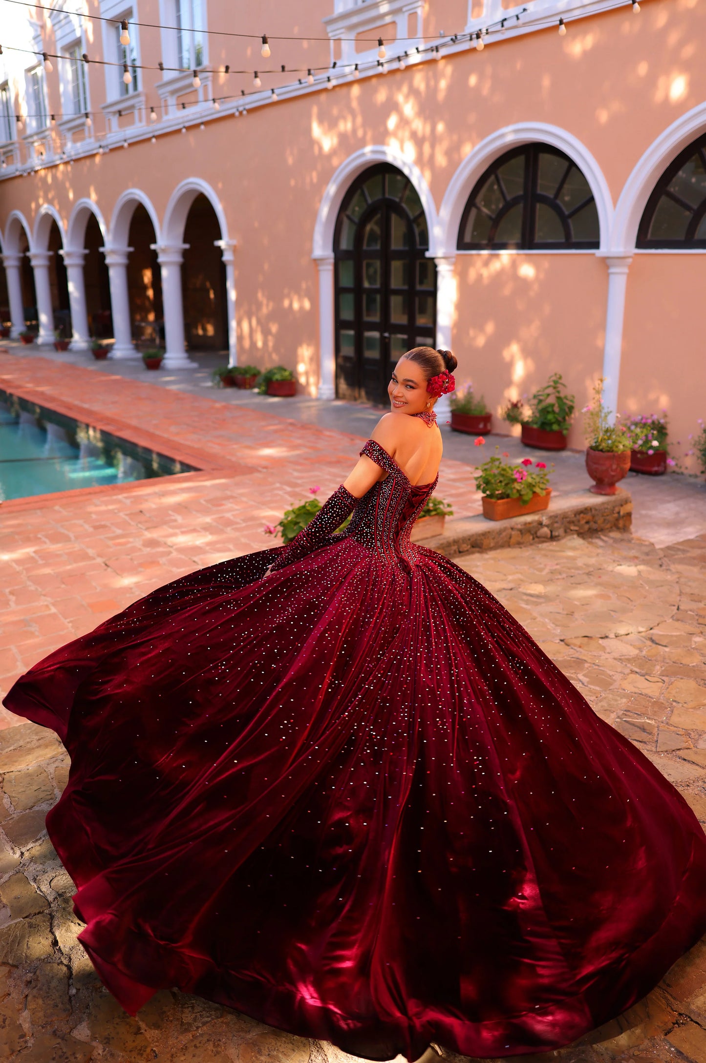 Elevate your quinceanera style with the luxurious Amarra 54257 dress. Made of velvet and adorned with crystal accents, it features a ball gown silhouette with an off-the-shoulder neckline. Complete the look with the included corset necklace and velvet gloves. A perfect choice for a night to remember.