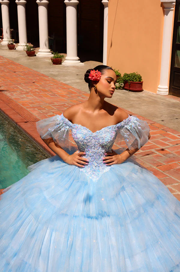 Elevate your Quinceañera look with the stunning Amarra 54312 dress. Featuring a layered tulle ball gown with a shimmering sequin bodice and an off-the-shoulder neckline, this dress will make you shine on your special day. The ombre corset adds a touch of glamour, making you the belle of the ball.&nbsp;