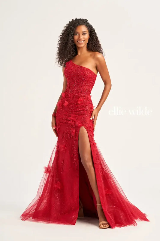 This Ellie Wilde EW35049 prom dress is designed with sheer shimmer lace, a one shoulder sheer lace corset bodice, and a mermaid silhouette with a backless design and a thigh-high slit. Perfect for prom or any formal occasion, this gown offers a touch of elegance and glamour, sure to turn heads and make a lasting impression. backless lace up  Sizes: 00-16  Colors: Emerald, Dark Red, Royal Blue