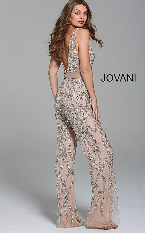 Silver Nude Plunging Neckline Beaded Contemporary Jumpsuit Jovani 61573  Sheer Illusion Rhinestone Crystal Embellishments Nude/Silver Deep V Neck Jumpsuit Pageants.  Silver and nude beaded contemporary jumpsuit with plunging neckline, low v-shaped back and sleeveless bodice, fully lined with wide waist belt and straight floor length leg.  Available colors:  Silver/Nude  Available sizes:  4