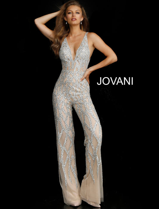 Silver Nude Plunging Neckline Beaded Contemporary Jumpsuit Jovani 61573  Sheer Illusion Rhinestone Crystal Embellishments Nude/Silver Deep V Neck Jumpsuit Pageants.  Silver and nude beaded contemporary jumpsuit with plunging neckline, low v-shaped back and sleeveless bodice, fully lined with wide waist belt and straight floor length leg.  Available colors:  Silver/Nude  Available sizes:  4