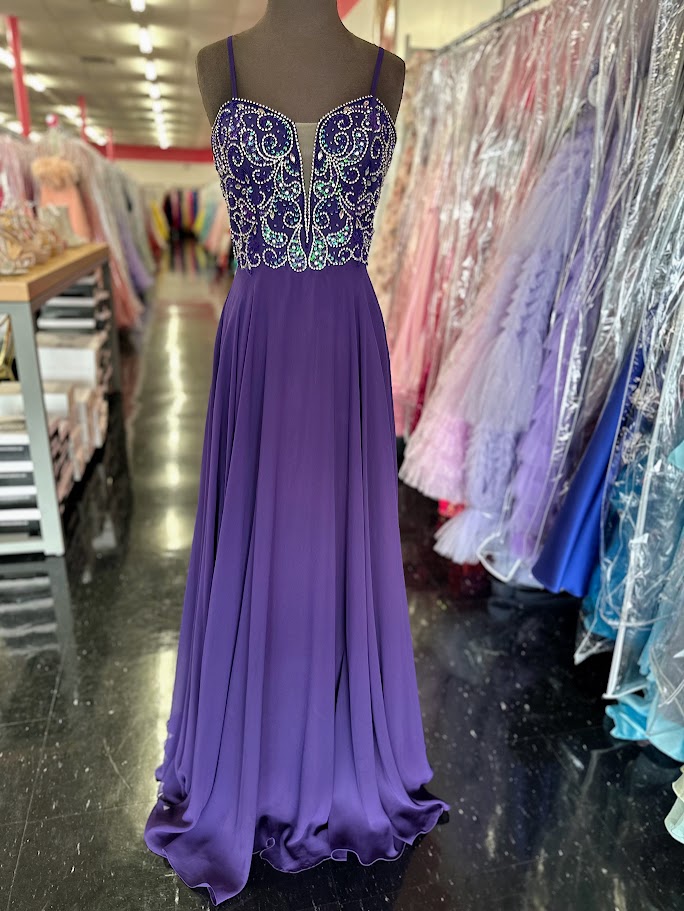 Nina Canacci 6509 Long flowing chiffon A Line Prom Dress. Featuring a Beaded &amp; Crystal Embellished Fitted bodice with a plunging neckline and spaghetti straps.&nbsp;

Available Sizes: 4, 6

Available Colors: Plum