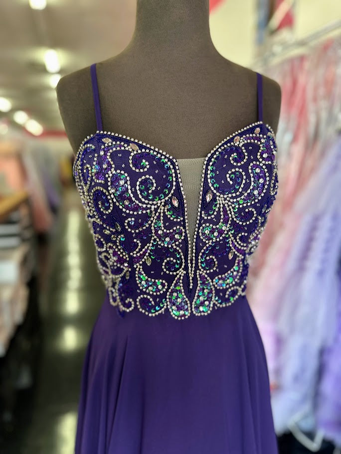 Nina Canacci 6509 Long flowing chiffon A Line Prom Dress. Featuring a Beaded &amp; Crystal Embellished Fitted bodice with a plunging neckline and spaghetti straps.&nbsp;

Available Sizes: 4, 6

Available Colors: Plum