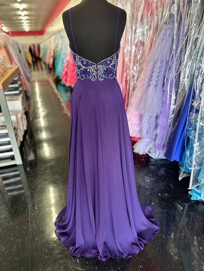 Nina Canacci 6509 Long flowing chiffon A Line Prom Dress. Featuring a Beaded &amp; Crystal Embellished Fitted bodice with a plunging neckline and spaghetti straps.&nbsp;

Available Sizes: 4, 6

Available Colors: Plum