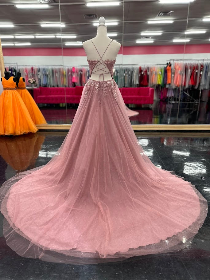 Expertly crafted by Nina Canacci, the 6624 Long A Line dress features a flattering corset bodice and a stunning backless design. The elegant train and A-line silhouette make it the perfect choice for prom, pageants, or any formal event. Elevate your style with this timeless and beautifully designed gown.

Sizes: 4

Colors: Mauve