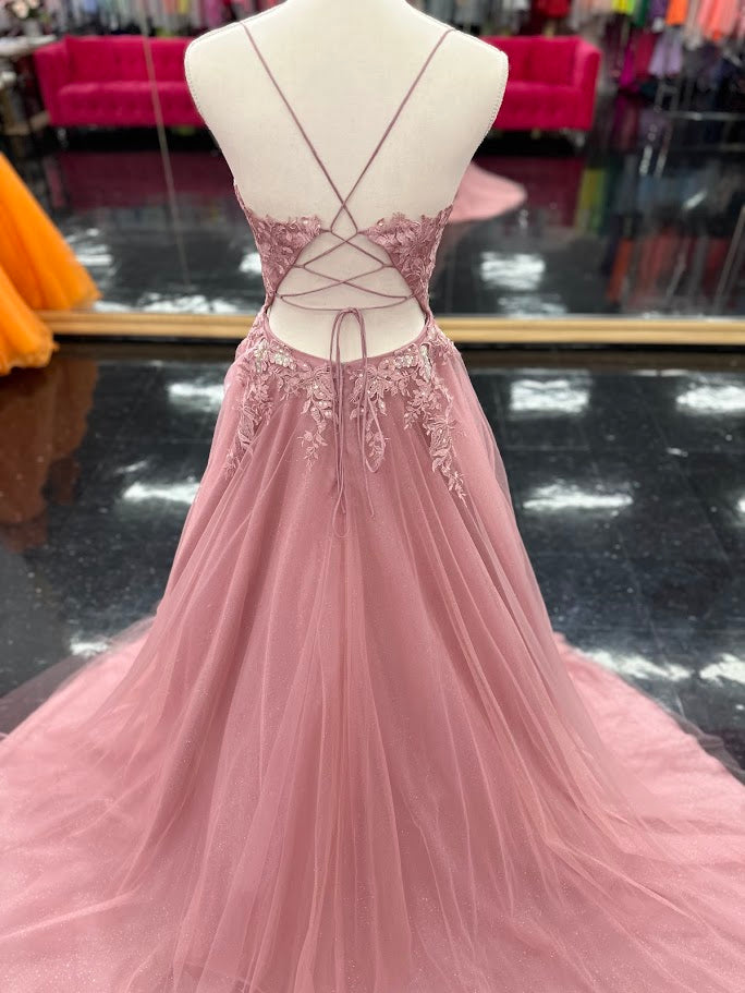 Expertly crafted by Nina Canacci, the 6624 Long A Line dress features a flattering corset bodice and a stunning backless design. The elegant train and A-line silhouette make it the perfect choice for prom, pageants, or any formal event. Elevate your style with this timeless and beautifully designed gown.

Sizes: 4

Colors: Mauve