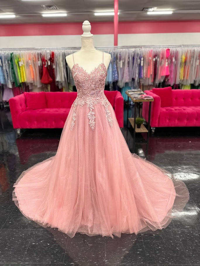 Expertly crafted by Nina Canacci, the 6624 Long A Line dress features a flattering corset bodice and a stunning backless design. The elegant train and A-line silhouette make it the perfect choice for prom, pageants, or any formal event. Elevate your style with this timeless and beautifully designed gown.

Sizes: 4

Colors: Mauve