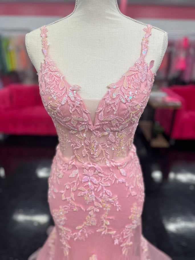This Nina Canacci 6627 gown in size 4 combines elegance and sparkle with its sheer corset-style bodice featuring delicate lace straps and a lace-up back. The glitter tulle mermaid skirt adds a shimmering finish, creating a sophisticated silhouette perfect for prom or formal occasions. Its refined design ensures you stand out with timeless grace and modern charm.

Size: 4

Color: Pink