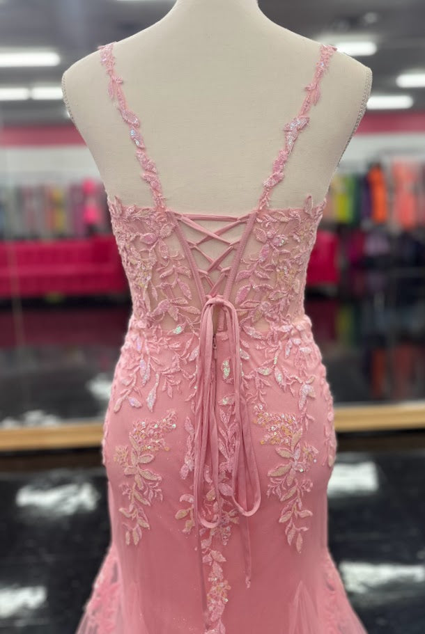 This Nina Canacci 6627 gown in size 4 combines elegance and sparkle with its sheer corset-style bodice featuring delicate lace straps and a lace-up back. The glitter tulle mermaid skirt adds a shimmering finish, creating a sophisticated silhouette perfect for prom or formal occasions. Its refined design ensures you stand out with timeless grace and modern charm.

Size: 4

Color: Pink