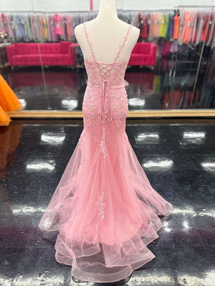 This Nina Canacci 6627 gown in size 4 combines elegance and sparkle with its sheer corset-style bodice featuring delicate lace straps and a lace-up back. The glitter tulle mermaid skirt adds a shimmering finish, creating a sophisticated silhouette perfect for prom or formal occasions. Its refined design ensures you stand out with timeless grace and modern charm.

Size: 4

Color: Pink