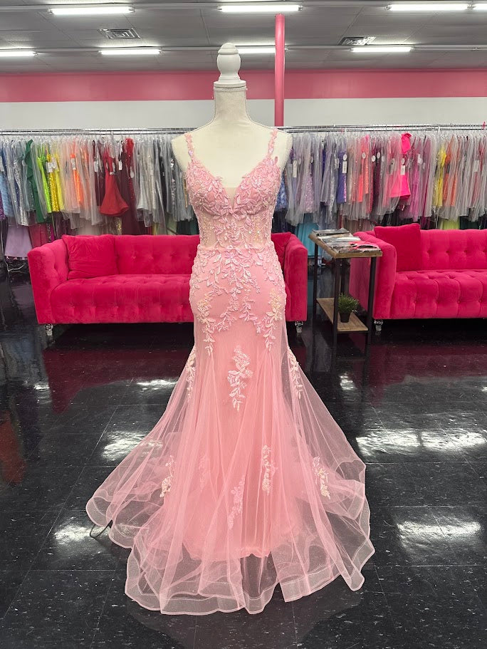 This Nina Canacci 6627 gown in size 4 combines elegance and sparkle with its sheer corset-style bodice featuring delicate lace straps and a lace-up back. The glitter tulle mermaid skirt adds a shimmering finish, creating a sophisticated silhouette perfect for prom or formal occasions. Its refined design ensures you stand out with timeless grace and modern charm.

Size: 4

Color: Pink