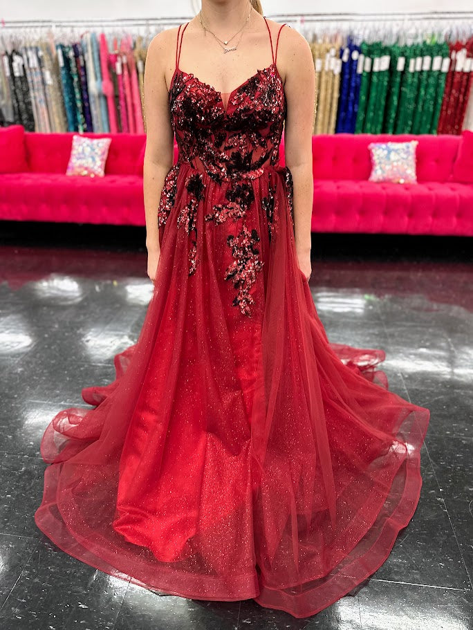 Elevate your evening with the Nina Canacci 6630, a size 4 burgundy gown that exudes elegance. This A-line dress features a shimmering sequin overlay and a daring maxi slit, complemented by a structured corset and a detachable side overskirt for added drama. Perfect for formal occasions, it combines classic sophistication with a modern edge to ensure you stand out gracefully.

Sizes: 4

Colors: Burgundy