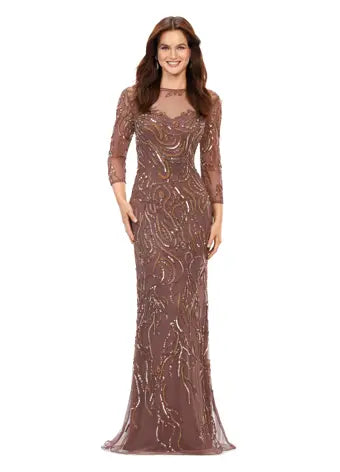 Ashley Lauren 11208 Three Quarter Sleeve Beaded Crew Neckline High Illusion Back Fully Hand Beaded Evening Gown. This gorgeous evening gown has a crew neckline, fitted mesh sleeves and a modern, intricate bead batter throughout. It is perfect for your next event.