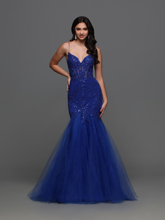 Elevate your prom night or formal event with the Candice Wang 72321 Lace Sheer Corset Mermaid Prom Dress. Made with intricate lace and a stunning cut out back, this dress will make you stand out from the crowd. The corset design provides a flawless fit, while the sequin embellishments add a touch of glamour. Make a statement in this timeless and elegant gown.   Sizes: 0-20  Colors: Black, Red, Cobalt
